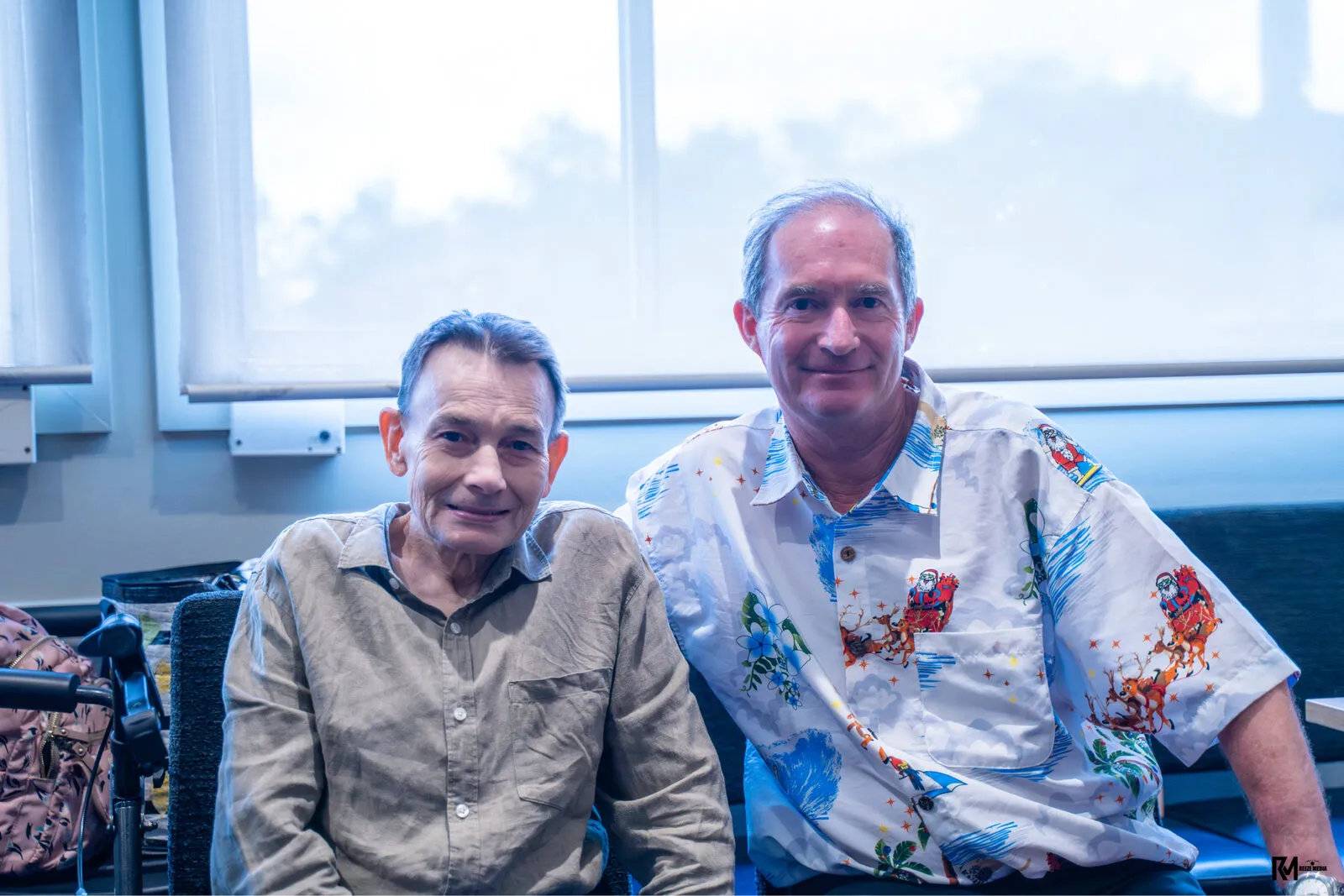 Two Phil Terry participants sitting side by side, smiling at the camera.