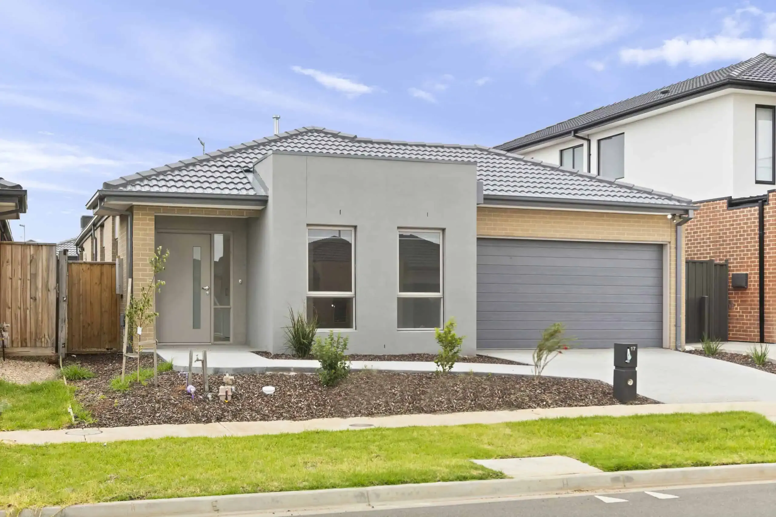 The street view of a modern single-storey supported home.