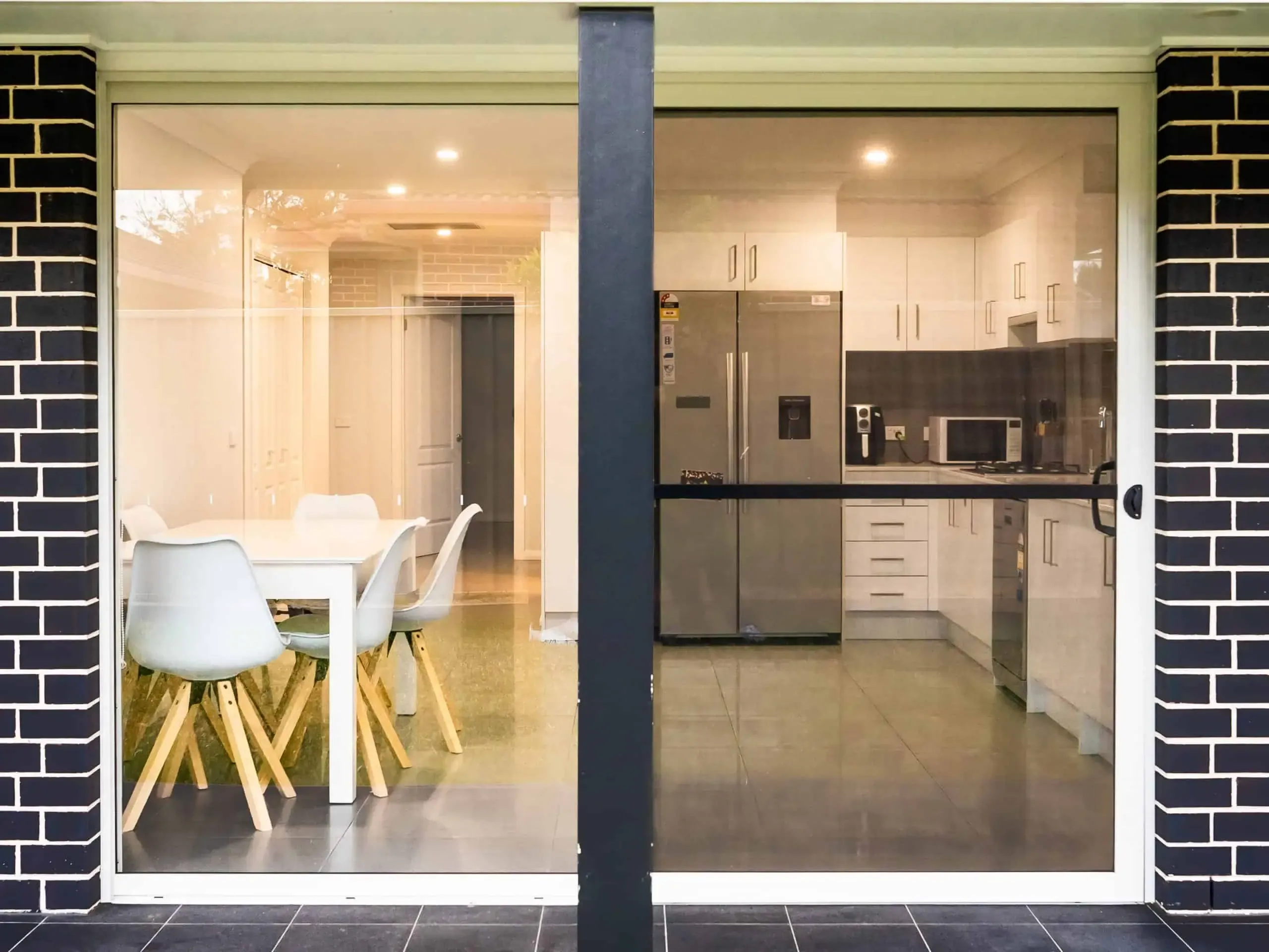 The covered patio and open-plan kitchen of a supported home.